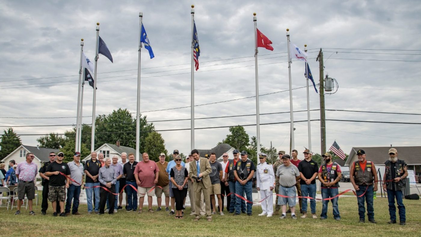 Mayor and veterans cutting the ribbon at the Bicknell veterans memorial
