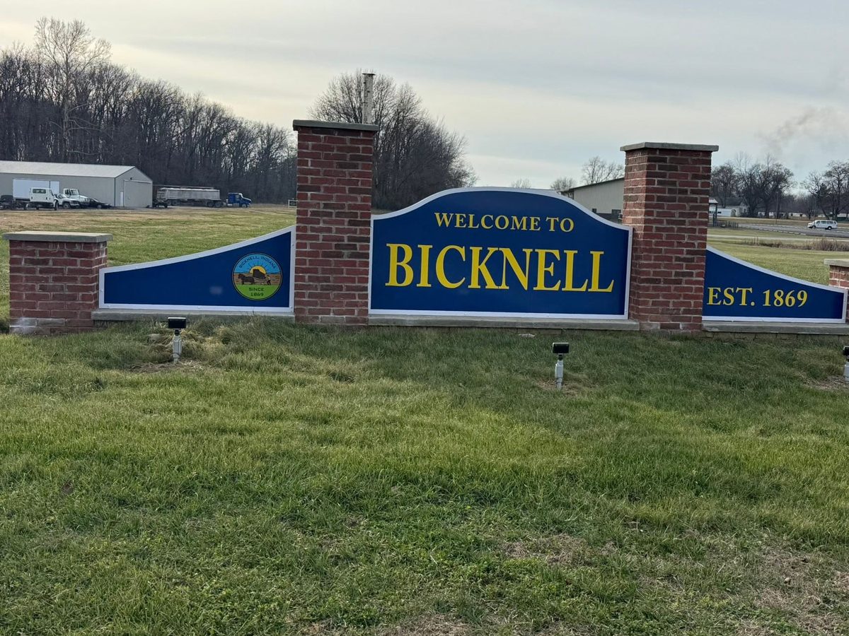 Brick Welcome to Bicknell sign, established 1869, with the city seal
